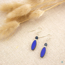 Load image into Gallery viewer, Czech glass blue oval drop earrings with a small glass beads and sterling silver detail.  These earrings are 2,5cm in drop length from the base of the ear wires and come with backs included.  They are presented in a pretty gift pouch for safe keeping.  Designed and Handmade in Dingle  If you would like your jewellery gift wrapped and a message added please add a little note in with your order and I will happily wrap it for you
