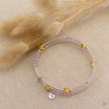 Load image into Gallery viewer, Hand wrapped silver filled tubes, with pretty pink faceted crystal beads and gold plated stars with sterling silver small bead detail. This bracelet is approximately 6 cm in diameter and simple wraps around the wrist to sit in place without the need of a clasp. It comes presented in a pretty gift pouch for safe keeping, or making it perfect for gift giving. Designed and Handmade in Dingle
