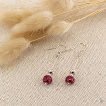 Load image into Gallery viewer, Silver filled drops with deep red spotted glass beads, sterling silver beads and stainless steel flat beads. These earrings sit on sterling silver ear wires and come with backs included. The drop length of these earrings is 4cm and measured from the base of the ear wire. They come in beautifully presented in an eco friendly branded gift box for safe keeping. Designed &amp; Handmade in Dingle
