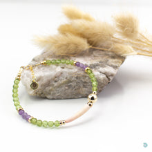 Load image into Gallery viewer, Natural Tusk Shell Bracelet with pretty faceted green peridot and amethyst stones and 14k gold filled detail.  This bracelet is 7in in length and has a 1 inch extension chain for adjustment.  It comes presented in a pretty gift box for safe keeping or making it perfect for gift giving.  Designed and Handmade in Dingle

