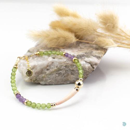 Natural Tusk Shell Bracelet with pretty faceted green peridot and amethyst stones and 14k gold filled detail.  This bracelet is 7in in length and has a 1 inch extension chain for adjustment.  It comes presented in a pretty gift box for safe keeping or making it perfect for gift giving.  Designed and Handmade in Dingle