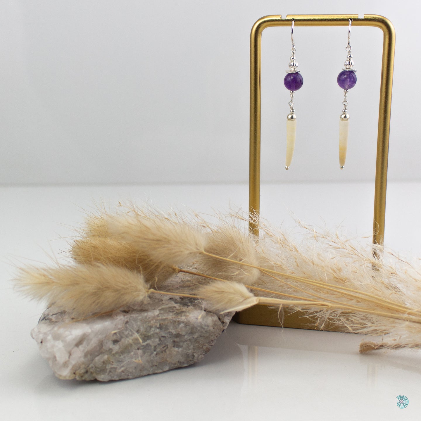 Natural tusk shell drop earrings with round smooth purple amethyst gemstones and sterling silver detail.  These earrings are lightweight and 5cm in drop length from the base of the ear wires.  They come presented in a pretty gift box or safe keeping. Designed and Handmade in Dingle