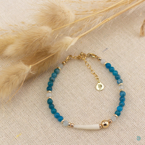Natural tusk shell bracelet with blue apatite quartz and aquamarine gemstones and 14k gold filled bead detail. This bracelet is 7in in length and comes with a 1 inch extension chain for adjustment. It comes presented in a pretty gift box for safe keeping or making it perfect for gift giving. Designed and Handmade in Dingle