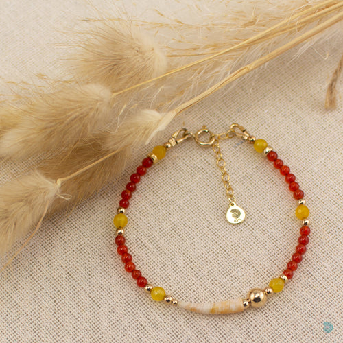 Beautiful natural tusk shell bracelet with carnelian and yellow agate stones with 14k gold filled bead detail.  This bracelet is 7inches in length and has a 1 inch extension chain for adjustment.  It comes presented in a branded gift box for safe keeping or making it perfect for gift giving  Designed and Handmade in Dingle  If you would like your jewellery gift wrapped and a message added please add a little note in with your order and I will happily wrap it for you