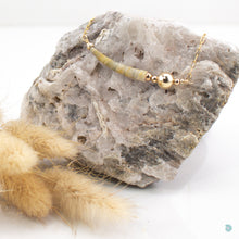 Load image into Gallery viewer, Beautiful single natural tusk shell, is gorgeous soft earthy colours with 14k gold filled bead detail.  This necklace sits on a 14k gold filled chain and is 16in in length and comes with a 2 inch extension chain for adjustment.  It comes presented in a branded gift box for safe keeping.  Designed and Handmade in Dingle
