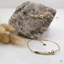 Load image into Gallery viewer, Simple elegance, natural tusk shell in a dark grey colour mix, that sits on a 14k gold filled chain with gold filled bead detail. This necklace is 16 in in length and comes presented in a pretty gift box for safe keeping. Designed &amp; Handmade in Dingle.  If you would like your jewellery gift wrapped and a message added please add a little note in with your order and I will happily wrap it for you
