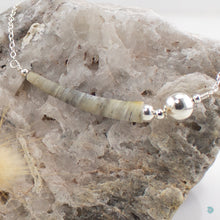 Load image into Gallery viewer, Beautiful single natural tusk shell, in gorgeous soft grey colours with sterling silver bead detail. This necklace sits on a sterling silver chain and is 16in in length and comes with a 2 inch extension chain for adjustment. It comes presented in a branded gift box for safe keeping. Designed and Handmade in Dingle
