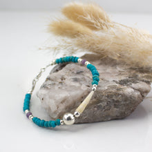 Load image into Gallery viewer, Natural tusk shell bracelet with faceted turquoise &amp; purple amethyst stones with sterling silver.  This bracelet is made using local tusk shells from my local beaches and combined with semi precious stones to create a unique piece of Irish jewellery.  It is 7.5 inches in length and comes presented in a pretty eco friendly gift box for safe keeping.  Designed and Handmade in Dingle.
