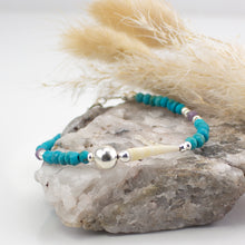 Load image into Gallery viewer, Natural tusk shell bracelet with faceted turquoise &amp; purple amethyst stones with sterling silver. This bracelet is made using local tusk shells from my local beaches and combined with semi precious stones to create a unique piece of Irish jewellery. It is 7.5 inches in length.  If you would like your jewellery gift wrapped just pop a little note in with your order
