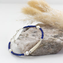 Load image into Gallery viewer, Natural tusk shell bracelet with faceted blue lapis jade stones, fresh water pearls and sterling silver.  This bracelet is made using local tusk shells from my local beaches and combined with semi precious stones to create a unique piece of Irish jewellery.  It is 8 inches in length and comes presented in a pretty eco friendly gift box for safe keeping.  Designed and Handmade in Dingle
