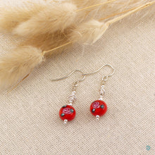 Load image into Gallery viewer, Short and Sweet Earrings with bright red floral lampwork glass beads and handwrapped silver filled scribble beads.  Sterling silver ear wires that come with backs.  They are 2.5cm in drop length from the base of the earwires and come in a pretty gift pouch for safe keeping.  Designed and Handmade in Dingle
