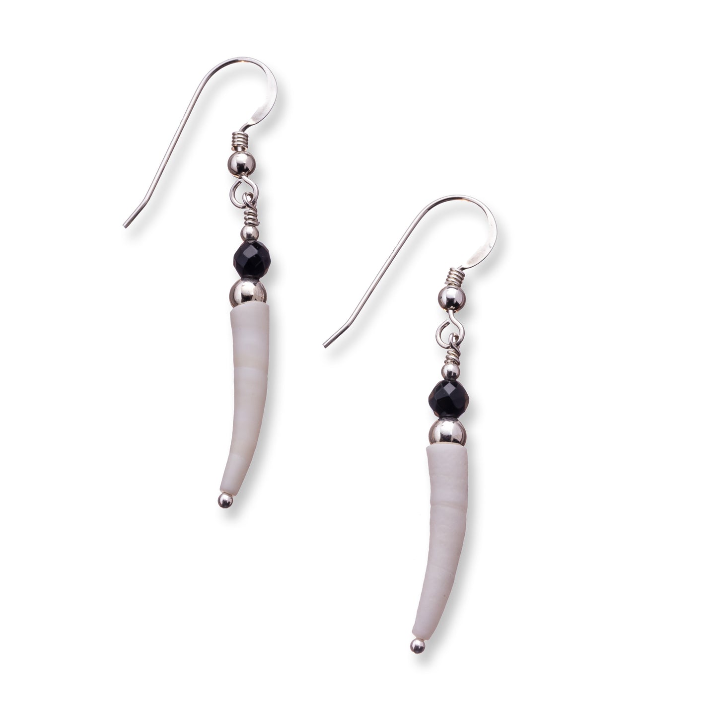 Simple natural Irish tusk shell drop earrings in a soft off white with small 4mm faceted black onyx stones and sterling silver beads.  These earrings are approximately 3.5cm in size and come with backs included. They are lightweight and easy to wear.  They come beautifully presented in an eco friendly branded gift box for safe keeping.  Designed and Handmade in Dingle. Due to the nature of the materials used, each pair is unique and will differ slightly from the image shown