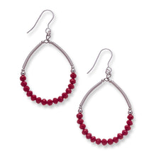 Load image into Gallery viewer, Statement hoops made from hand wrapped silver filled tubes, small sterling silver beads and feature small faceted rich red crystal glass beads in a semi circle.  These earrings sit on sterling silver ear wires and come with backs included. The drop length is 4.5cm and measured from the base of the ear wire.  They come beautfully presented in an eco friendly branded gift box for safe keeping. Designed &amp; Handmade in Dingle
