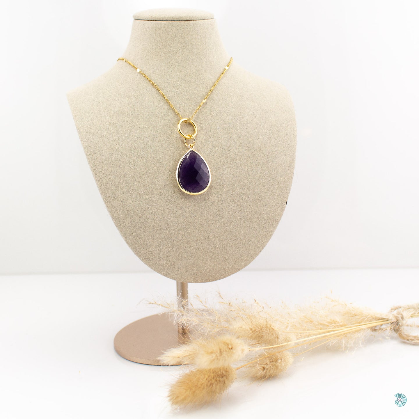 Large Amethyst teardrop pendant, sitting on a small chunky gold plated hoop, suspended on a gold plated stainless steel chain.  This necklace is 20 inches in length with a 2inch extension chain.  It comes presented in a pretty gift box for safe keeping or making it perfect for gift giving.  Designed and made in Dingle