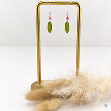 Load image into Gallery viewer, Czech glass green oval drop earrings with a small pink glass beads and sterling silver detail.  These earrings are 2,5cm in drop length from the base of the ear wires and come with backs included.  They are presented in a pretty gift pouch for safe keeping.  Designed and Handmade in Dingle  If you would like your jewellery gift wrapped and a message added please add a little note in with your order and I will happily wrap it for you
