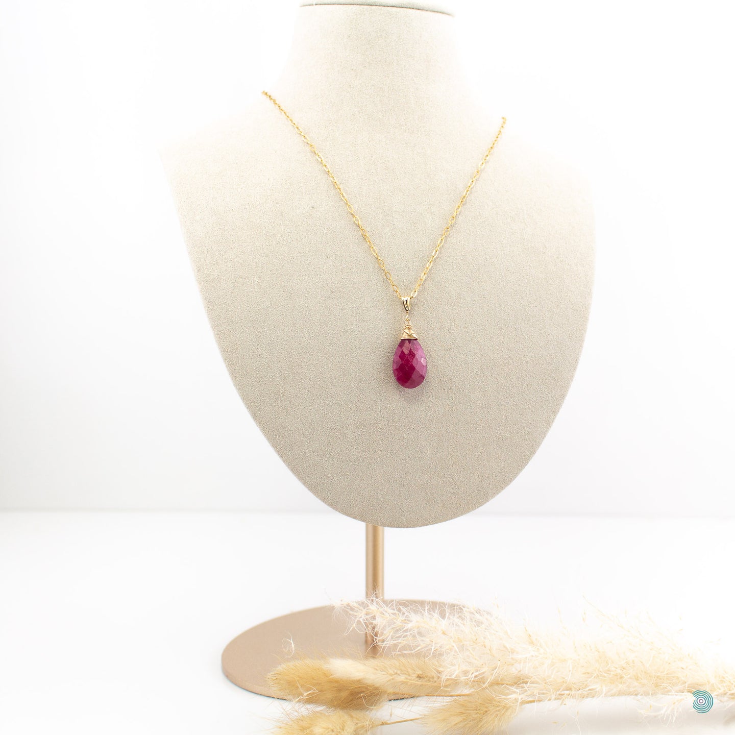 Beautiful, simple style, faceted ruby red teardrop pendant, wrapped in a 14k gold filled nest that sits on a gold filled chain. 18inches in length with a 2 inch extension chain for adjustment. Designed and Handmade in Dingle.