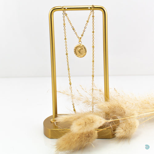 Gold plated stainless steel half moon disc charm pendant. This pendant is 14mm in size and sits on a gold plated stainless steel satellite chain. It is 18 inches in length and comes presented in an eco friendly linen gift pouch for safe keeping.
