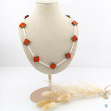 Load image into Gallery viewer, Hand wrapped silver filled tubes with vibrant orange Czech glass diamond shaped beads and sterling silver small bead detail. This necklace is 18 inches in length with a 2 inch extension chain for adjustment. It comes beautifully presented in a branded gift box for safe keeping or making it perfect for gift giving Designed and Handmade in Dingle
