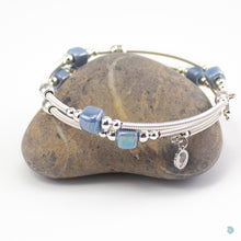 Load image into Gallery viewer, Hand wrapped silver filled wrap around bracelet, pale blue ceramic cubes and silver bead detail. Approximate diameter is 6cm and is flexible to fit most wrist sizes. This bracelet has no clasp is simply wraps around the wrist and sits in place. Designed and Handmade in Dingle, Ireland. KellyMarie Jewellery Design
