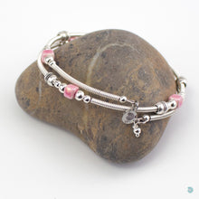 Load image into Gallery viewer, Hand wrapped silver filled wrap around bracelet, pink ceramic cubes and silver bead detail. Approximate diameter is 6cm and is flexible to fit most wrist sizes. This bracelet has no clasp is simply wraps around the wrist and sits in place. Designed and Handmade in Dingle, Ireland. KellyMarie Jewellery Design
