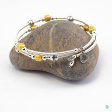 Load image into Gallery viewer, Hand wrapped silver filled wrap around bracelet, yellow ceramic cubes and silver bead detail. Approximate diameter is 6cm and is flexible to fit most wrist sizes. This bracelet has no clasp is simply wraps around the wrist and sits in place. Designed and Handmade in Dingle, Ireland. KellyMarie Jewellery Design
