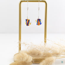 Load image into Gallery viewer, Colourful summer drop earrings, with hand wrapped silver filled tubes, sterling silver bead and ear wire detail with beautiful lamp work glass beads in a mix of reds/blues and yellows.  These earrings are 3.5cm in drop length from the base of the ear wires and come with backs included.  They come presented in a pretty gift box for safe keeping or making them perfect for gift giving  Designed and Handmade in Dingle 
