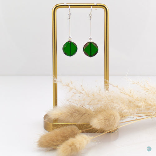 Simple drop earrings of hand wrapped silver filled tubes, Rich green Czech glass beads and sterling silver bead detail.  These earrings are 4cm in drop length from the base of the ear wires and come with backs included.  They are presented in a pretty gift pouch for safe keeping or making them perfect for gift giving