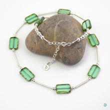 Load image into Gallery viewer, Hand wrapped silver filled tubes, with pretty green coloured Czech glass and sterling silver beads.  This necklace is 18 inches in length and has a 2 inch extension chain for adjustment.  It comes in a branded gift box for safe keeping or making it perfect for gift giving.  Designed and Handmade in Dingle .
