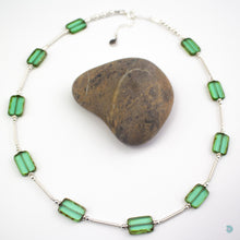 Load image into Gallery viewer, Hand wrapped silver filled tubes, with pretty green, rectangular Czech glass and sterling silver beads.  This necklace is 18 inches in length and has a 2 inch extension chain for adjustment.  It comes in a branded gift box for safe keeping or making it perfect for gift giving.  Designed and Handmade in Dingle  If you would like your jewellery gift wrapped and a message added please add a little note in with your order and I will happily wrap it for you
