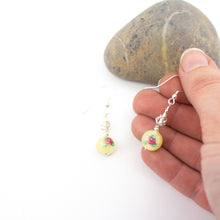 Load image into Gallery viewer, Short and Sweet Earrings with sunny yellow floral lampwork glass beads and handwrapped silver filled scribble beads. Sterling silver ear wires that come with backs. They are 2.5cm in drop length from the base of the earwires and come in a pretty gift pouch for safe keeping. Designed and Handmade in Dingle
