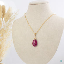 Load image into Gallery viewer, Beautiful, simple style, faceted ruby red teardrop pendant, wrapped in a 14k gold filled nest that sits on a gold filled chain. 18inches in length with a 2 inch extension chain for adjustment.  Designed and Handmade in Dingle.  If you would like your jewellery gift wrapped and a message added please add a little note in with your order and I will happily wrap it for you! 
