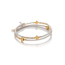Load image into Gallery viewer, One size wrap around bangle style bracelet made from hand coiled silver filled tubes, with pretty gold plate stars, small faceted champgane  coloured crystals &amp; sterling silver beads.  This bracelet has no clasp, it is flexible and simply wraps around the wrist and stays in place.  It comes wrapped and presented in an eco friendly pretty linen gift pouch for safe keeping. Designed &amp; Handmade in Dingle
