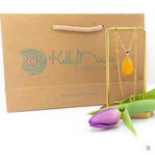 Load image into Gallery viewer, Simple and vibrant yellow jade teardrop pendant. This piece is 18 inches in length and sits on a gold plated stainless steel woven style chain. It comes presented in a pretty gift box for safe keeping or making it perfect for gift giving Designed and Made in Dingle
